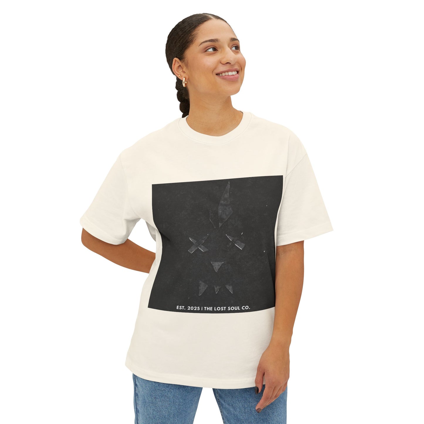 Model wearing Broken Face oversized boxy tee in Natural – front view.
