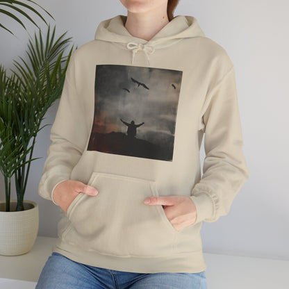 Model close up view of Sand hoodie featuring lone figure with arms raised beneath flying birds against a moody sky – The Lost Soul Co.