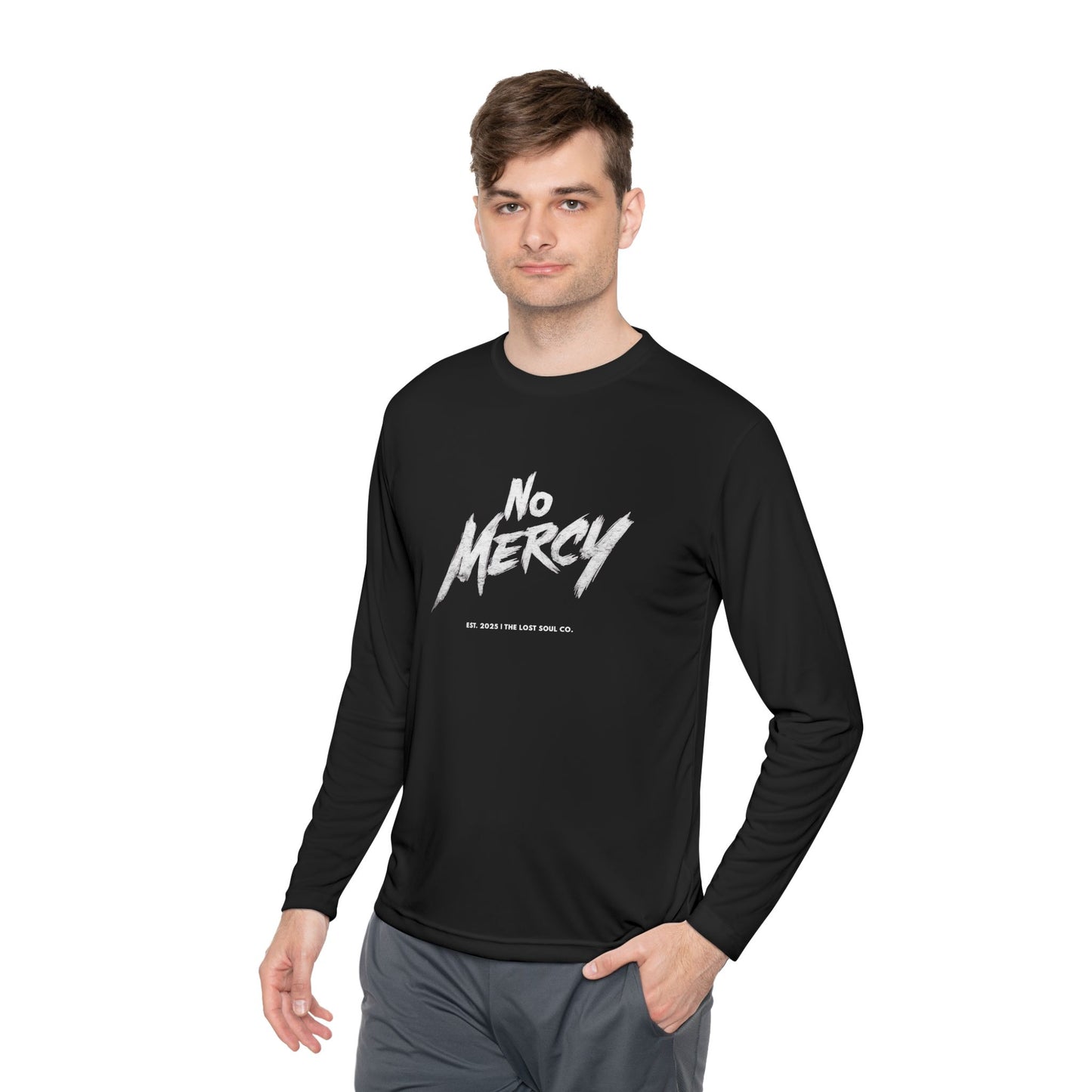 Model wearing a black unisex long sleeve tee with bold white “NO MERCY” brush lettering across the chest — motivational gymwear by The Lost Soul Co.