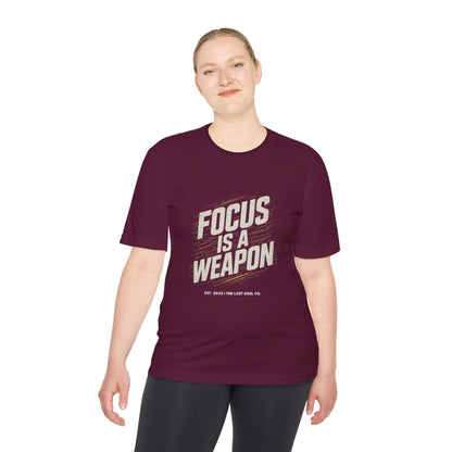Person wearing The Lost Soul Co. gymwear tee with bold ‘FOCUS IS A WEAPON’ graphic and gold streaks