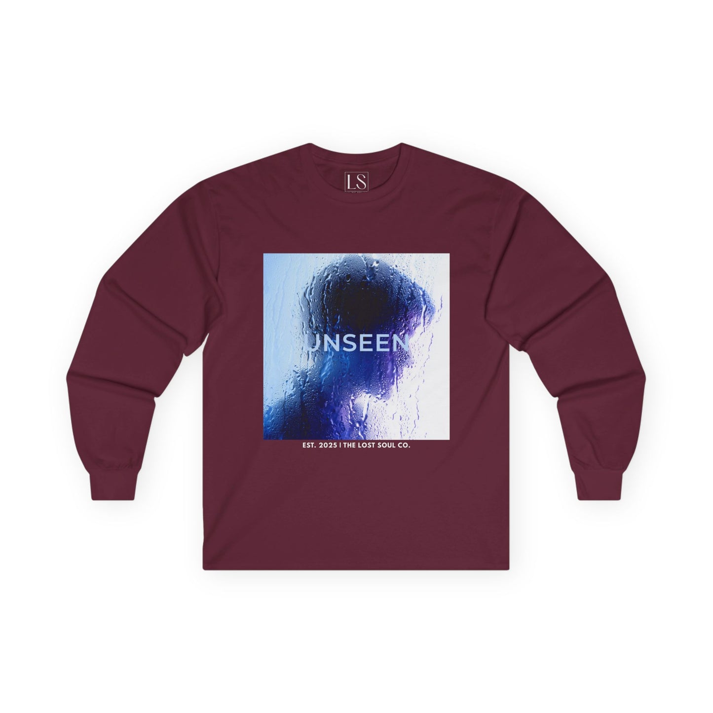 Front mockup of “UNSEEN” long sleeve maroon tee silhouette behind wet glass in blue tones with brand name below.