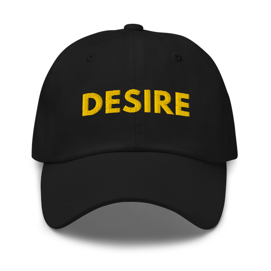 Black classic dad hat with gold “DESIRE” embroidery on front and small “LS” logo on back, premium minimal streetwear design by The Lost Soul Co.
